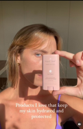 Woman applying Project Reef sunscreen outdoors