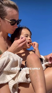 Woman smiling with Project Reef sunscreen