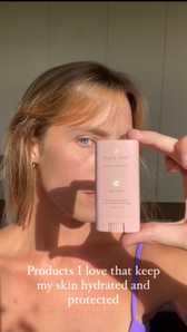 Woman applying Project Reef sunscreen to face