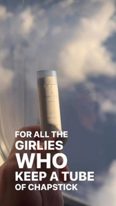 A girl holds a Chapstick