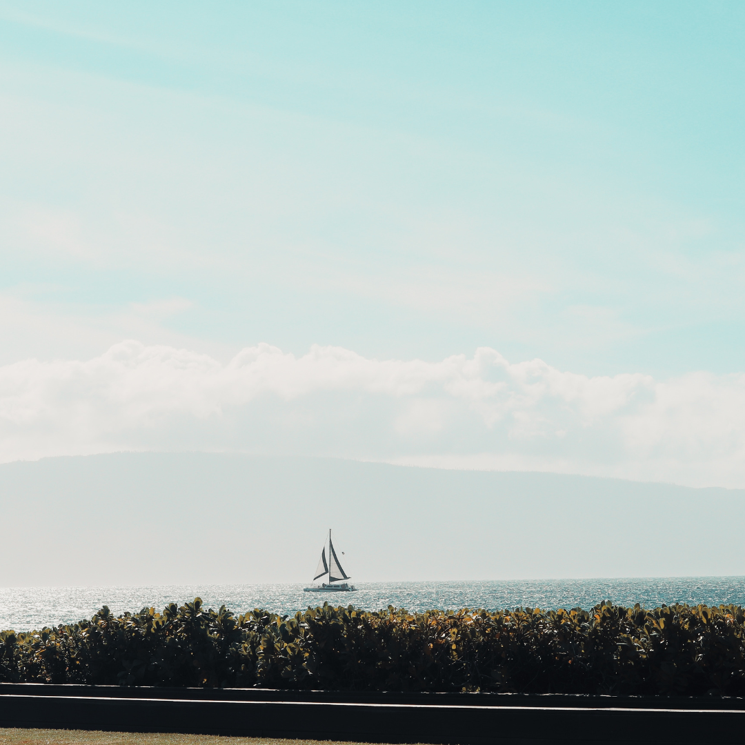 Sailboat on the horizon with a clear sky