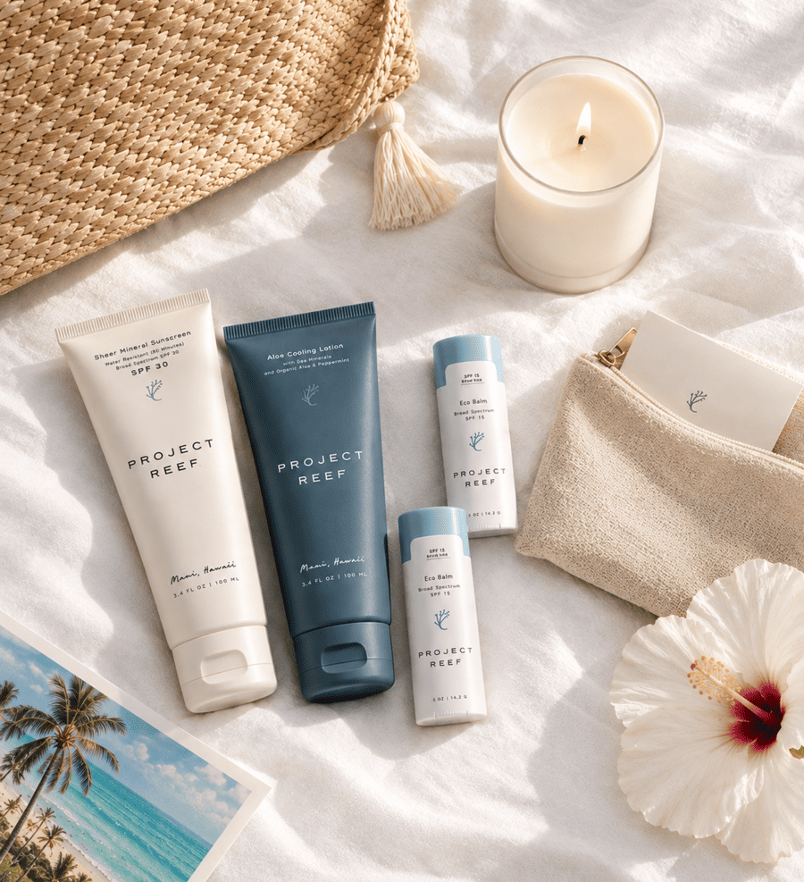 A curated destination wedding gift items on white linen featuring Project Reef sunscreen products.