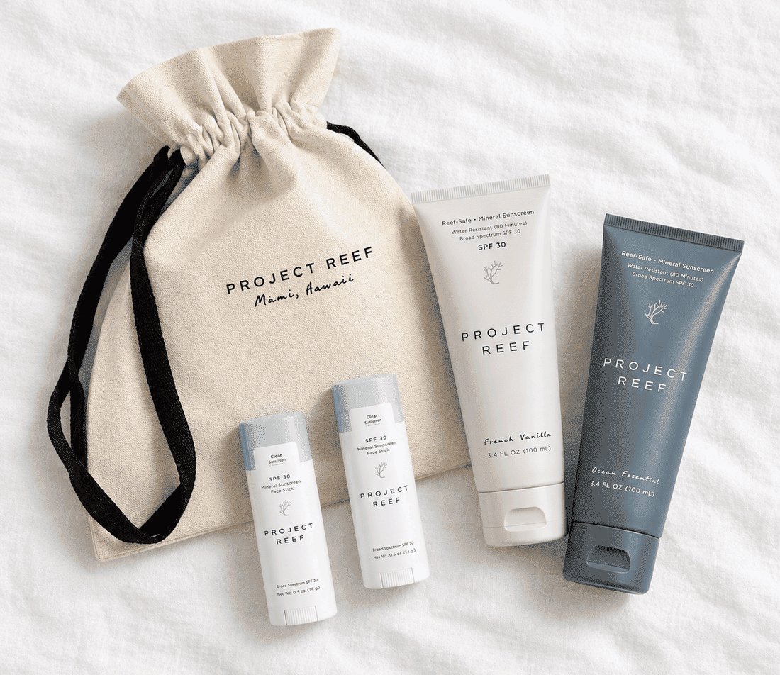A flat lay of premium corporate event giveaways featuring Project Reef’s reef-safe mineral sunscreen.