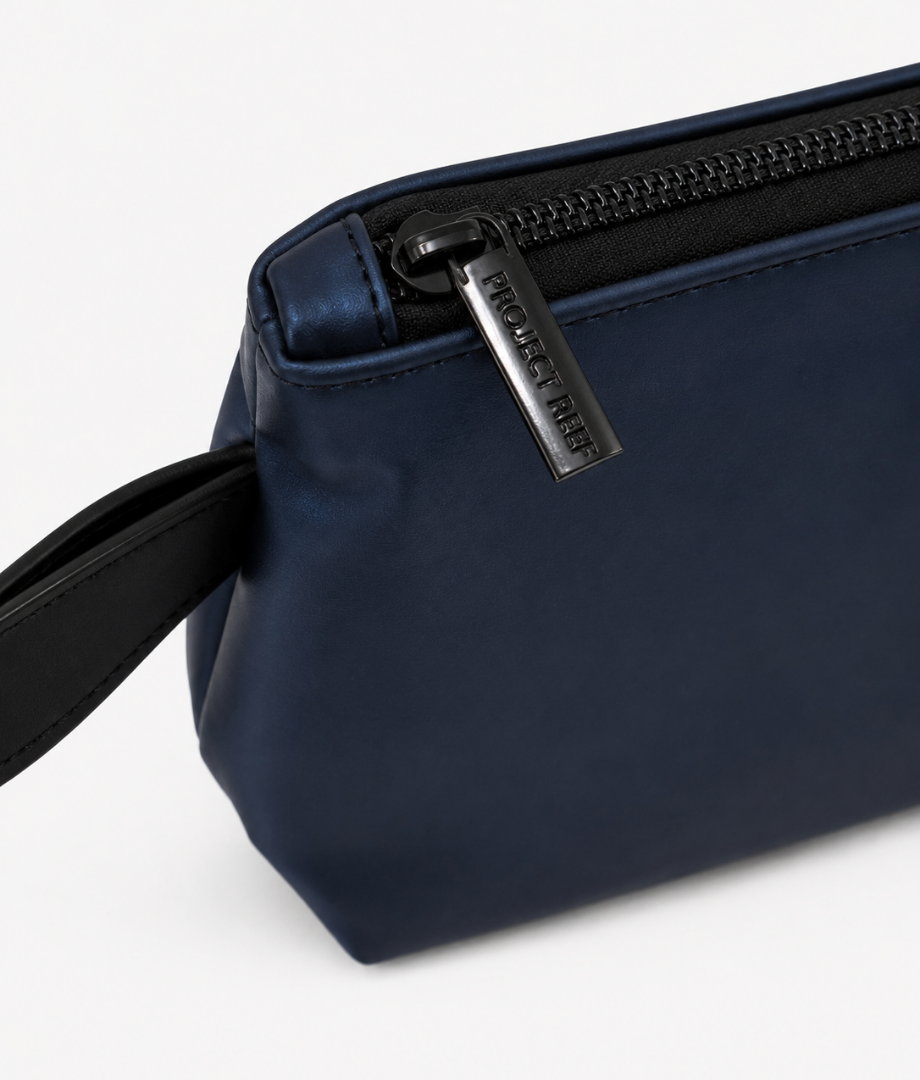 Navy blue sun care pouch with a zipper on a white background
