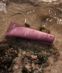 Project Reef SPF 50 mineral sunscreen tube on a beach 