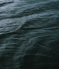 Close-up of ocean waves linked to after sun cooling lotion.