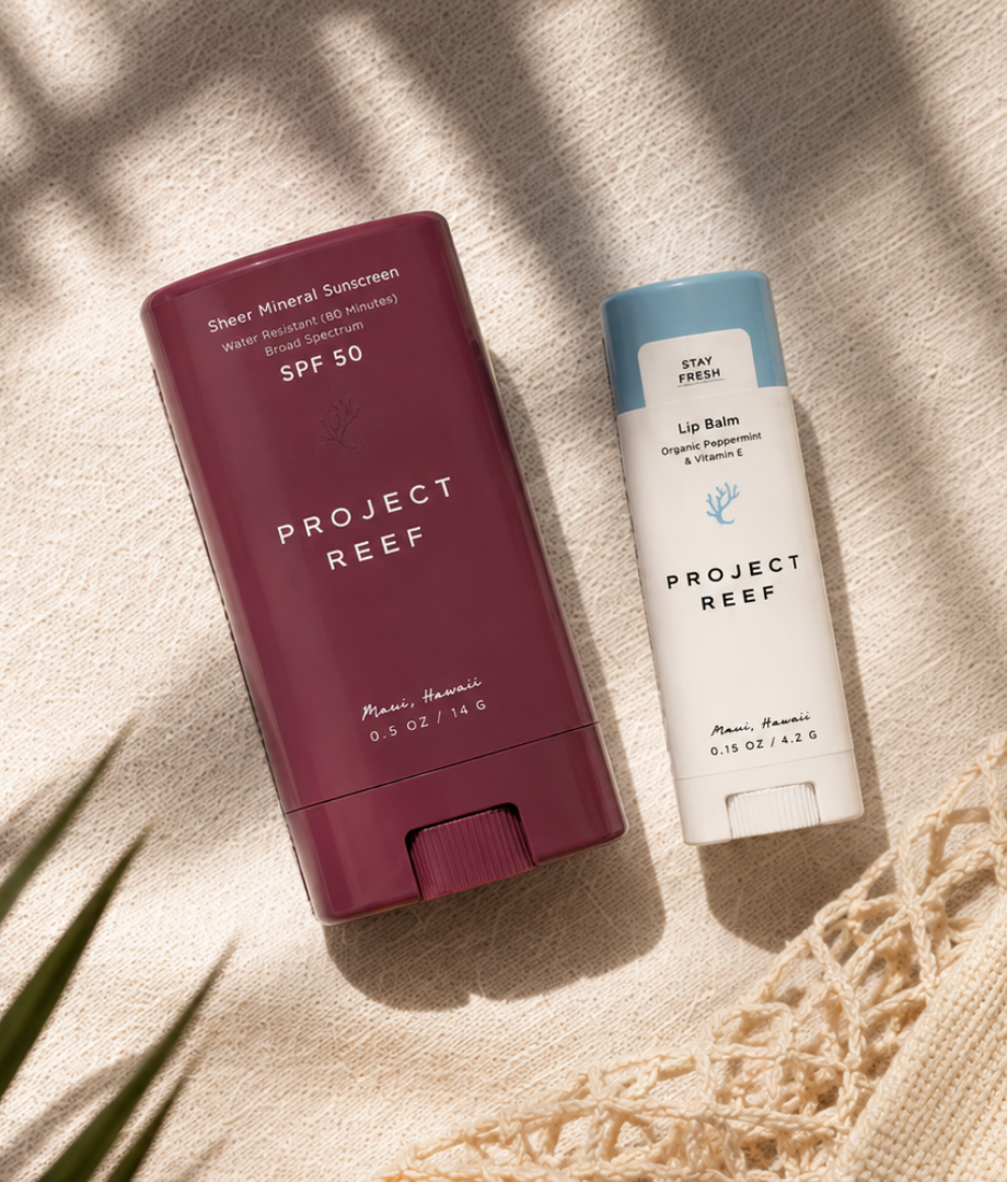 Two Project Reef sun care products on a textured surface 