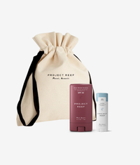 Project Reef sunscreen products including a stick and a bottle with a drawstring bag on a white background.